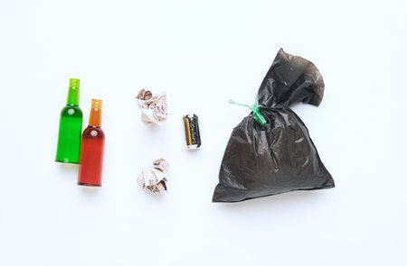 A picture of rubbish miniature on isolated white background. Rubbish and waste management concept