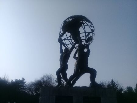 Chuncheon, Seoul South Korea, January 21, 2018: Sculpture of several naked men holding world in hands, placed in Kangwon National Universityのeditorial素材