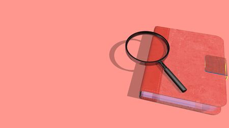 Beautiful book or note book with a magnifying glass on it. Book is on a colored background with shadow from light above.の写真素材