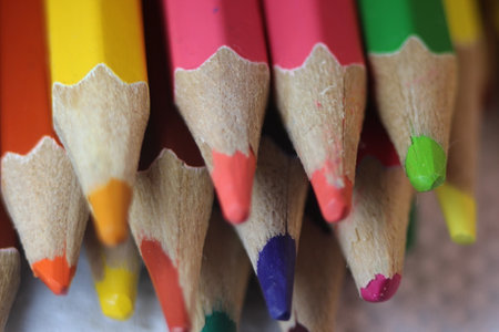 Close-up view of bright colored multicolor pencils on black backgroundの写真素材
