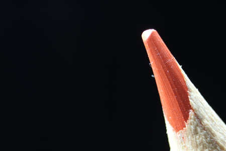 close up of sharpened pencil.Macro view of the tip of the pencil on a black background.の写真素材