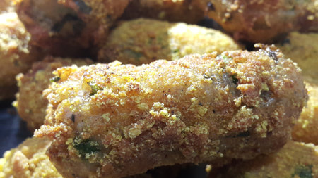 Closeup perspective view of home made spicy and delicious croquettes served with tea or other dishes during parties as fast food.の写真素材