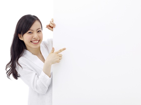 woman holding a blank billboard.の写真素材