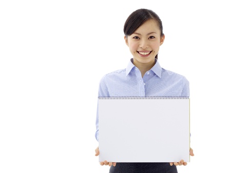 Young asian woman is holding empty text board over white backgroundの写真素材