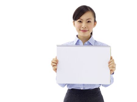 Young asian woman is holding empty text board over white backgroundの写真素材