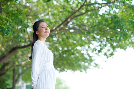 a portrait of young woman in the forestの写真素材