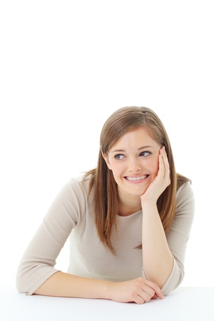Portrait of smiling woman resting her chin on handの写真素材