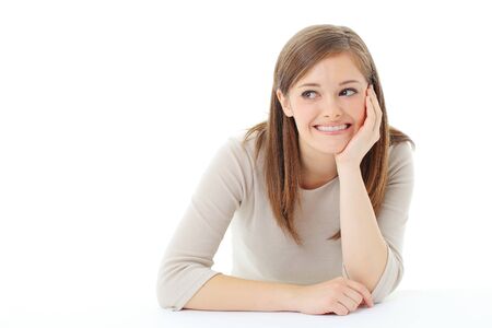 Portrait of smiling woman resting her chin on handの写真素材