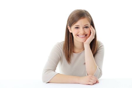 Portrait of smiling woman resting her chin on handの写真素材