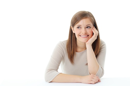 Portrait of smiling woman resting her chin on handの写真素材