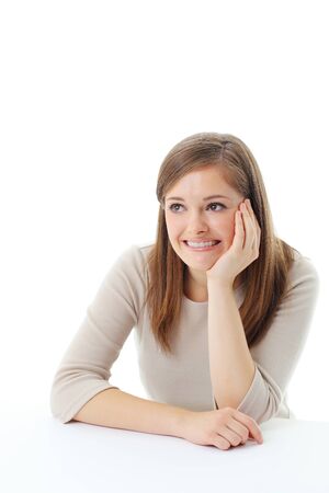 Portrait of smiling woman resting her chin on hand の写真素材