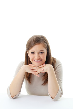 Portrait of smiling woman resting her chin on hand の写真素材