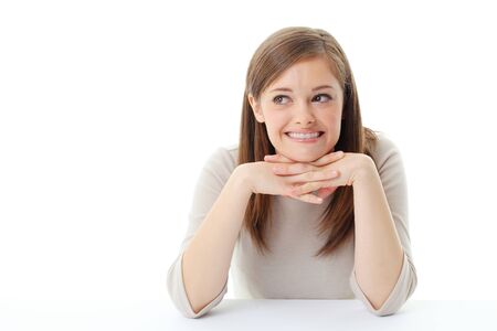 Portrait of smiling woman resting her chin on hand の写真素材