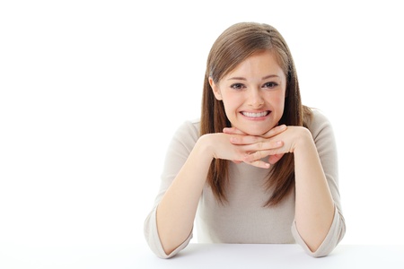 Portrait of smiling woman resting her chin on hand の写真素材