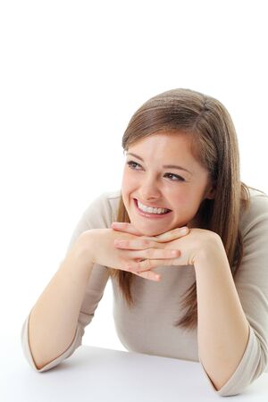 Portrait of smiling woman resting her chin on hand の写真素材