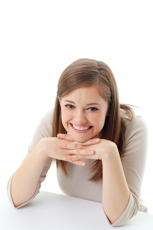 Portrait of smiling woman resting her chin on hand の写真素材