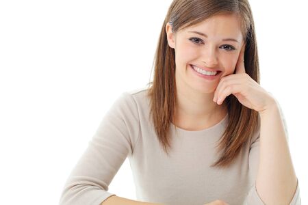 Portrait of smiling woman resting her chin on hand の写真素材
