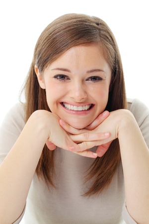 Portrait of smiling woman resting her chin on hand の写真素材