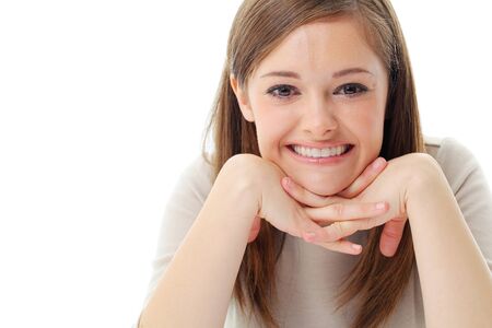 Portrait of smiling woman resting her chin on hand の写真素材