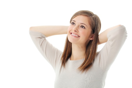 Happy woman with stretched arms sitting on couch isolatedの写真素材