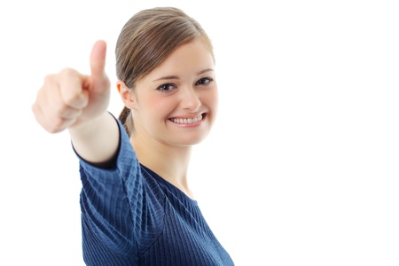 Portrait of smiling business woman showing thumbs up gesture on white backgroundの写真素材