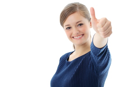 Portrait of smiling business woman showing thumbs up gesture on white backgroundの写真素材