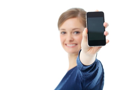 Young girl holding out mobile phoneの写真素材