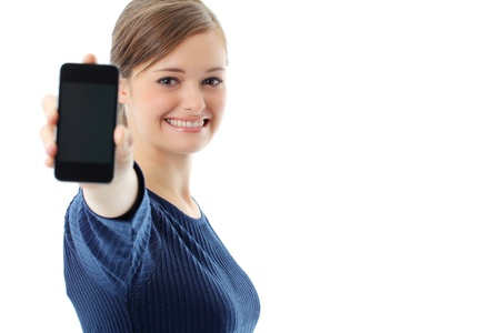 Young girl holding out mobile phoneの写真素材