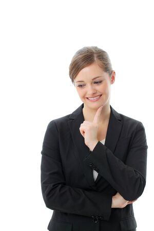 Portrait of a happy business woman lost in thoughtsの写真素材