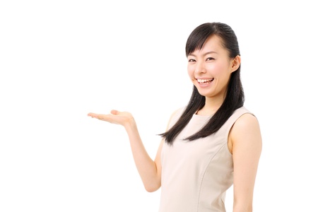 beautiful young girl introducing somethingの写真素材