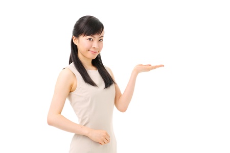 beautiful young girl introducing somethingの写真素材