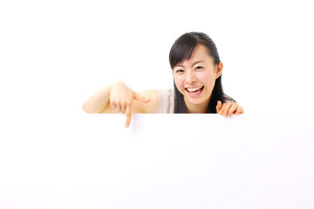 young business woman holding blank billboard, isolated on white backgroundの写真素材