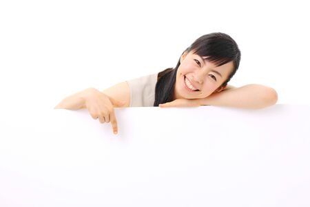 young business woman holding blank billboard, isolated on white backgroundの写真素材