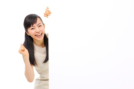 young business woman holding blank billboard, isolated on white backgroundの写真素材