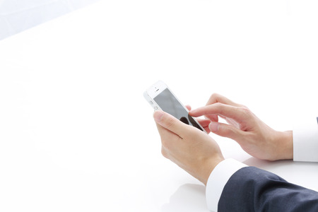 Close up of man using mobile smart phoneの写真素材