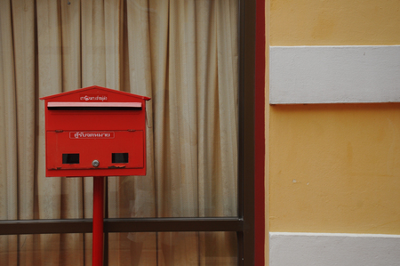 Red mailbox on pole