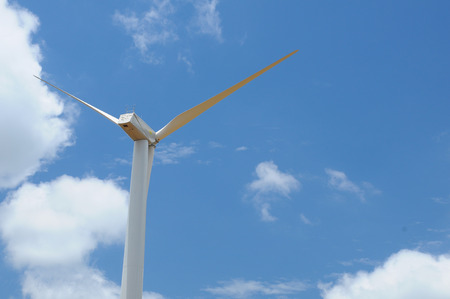 wind turbine propeller blades against sky