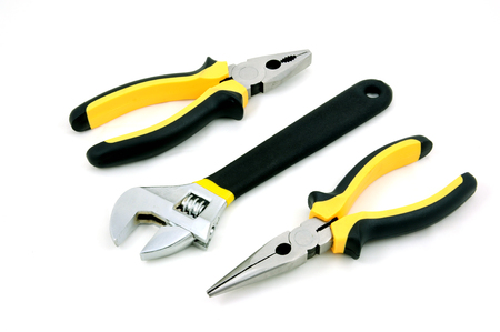 Adjustable wrench, long & Flat nose pliers isolated on white backgroundの写真素材