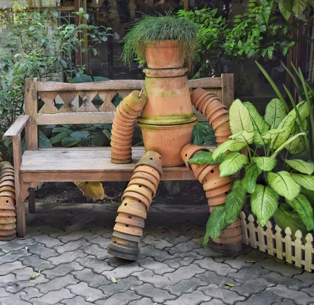 Potted plants lined a robot decked garden.の写真素材