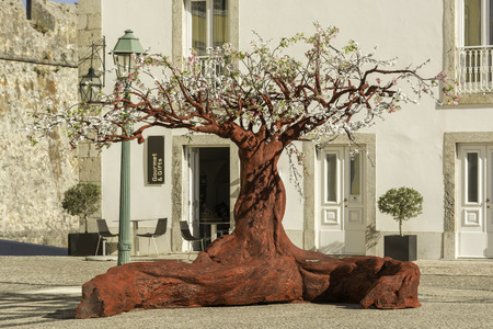 Red tree in a public place for visitors to enjoy and have funの写真素材