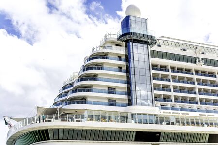 Cruise ship fragment with blue sky and cloudsの写真素材