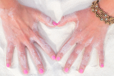 Hands on sandの写真素材