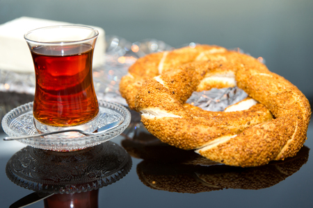 Sesame ring with Butter and teaの写真素材