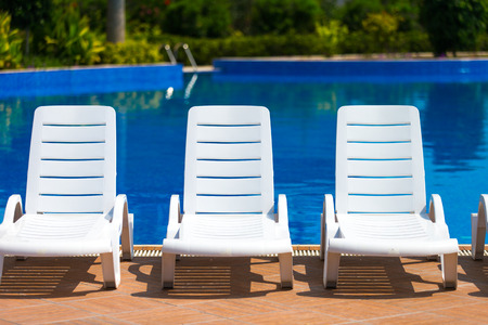 Sun chairs at the poolの写真素材