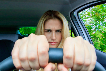 Woman is driving her carの写真素材