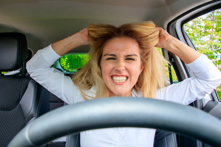 Woman is driving her carの写真素材