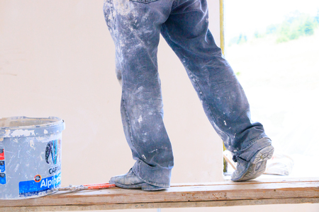 Construction worker with jeans and street shoesの写真素材