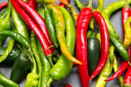 Green and red fresh peppersの写真素材