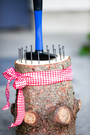 The bride and groom hammer the nailの写真素材