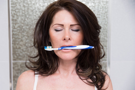 Beautiful woman in bathroomの写真素材